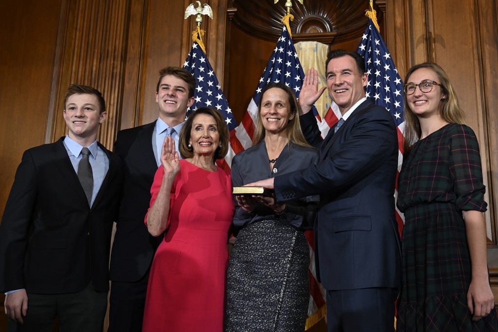 House Speaker Nancy Pelosi of Calif., third from left, poses during a ceremonial swearing-in with Rep. Tom Suozzi, D-N.Y., second from right, on Capitol Hill in Washington, Thursday, Jan. 3, 2019, during the opening session of the 116th Congress. (AP Photo/Susan Walsh)