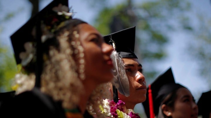 Graduating students listen during the 365th Commencement Exercises at Harvard University on May 26, 2016.